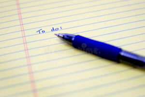 To Do List Written On Paper With Blue Pen Organizing And Plannin Stock